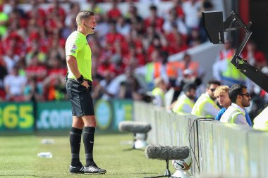 Referee Robert Jones goes to the VAR screen