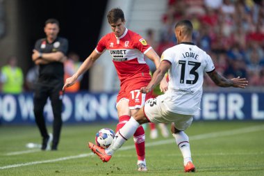 Paddy McNair #17 of Middlesbrough is tackled by Max Lowe #13 of Sheffield United during the second half 