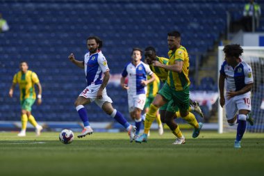 Bradley Dack #23 of Blackburn Rovers  plays the ball through to Tyrhys Dolan
