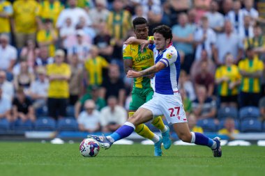 Grady Diangana #11 of West Bromwich Albion competes for the ball with Lewis Travis #27 of Blackburn Rovers  