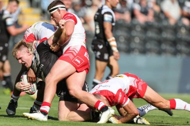Brad Fash #17 of Hull FC is tackled by the St Helens defence