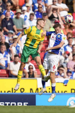 Jayson Molumby #14 of West Bromwich Albion competes for a header with Tyler Morton #6 of Blackburn Rovers  