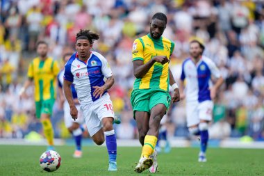 Semi Ajayi #6 of West Bromwich Albion under pressure from Tyrhys Dolan #10 of Blackburn Rovers  
