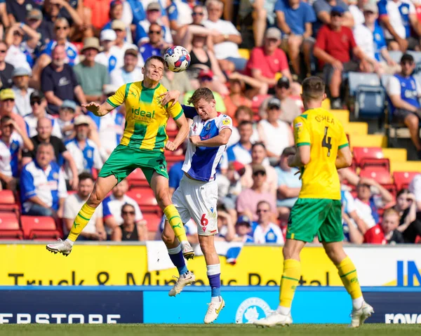 Jayson Molumby #14 of West Bromwich Albion competes for a header with Tyler Morton #6 of Blackburn Rovers  