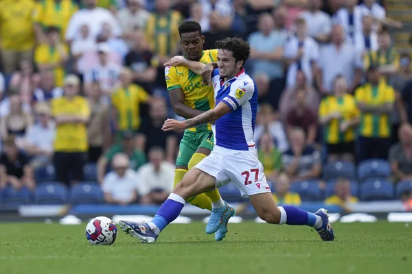 Grady Diangana #11 of West Bromwich Albion competes for the ball with Lewis Travis #27 of Blackburn Rovers  