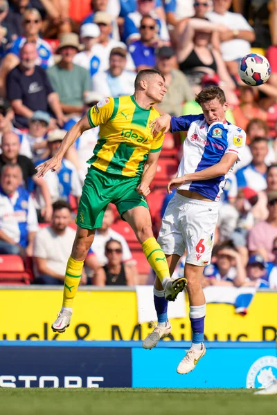 Jayson Molumby #14 of West Bromwich Albion competes for a header with Tyler Morton #6 of Blackburn Rovers  