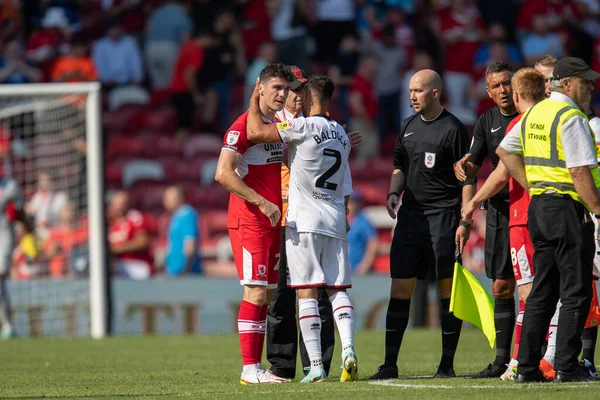 George Baldock #2 of Sheffield United and Darragh Lenihan #26 of Middlesbrough hug after the game 