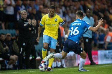 Liam Palmer #2 of Sheffield Wednesday gets the ball past Harrison Burrows #16 of Peterborough United during the first half 