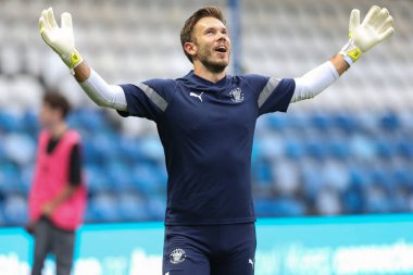 Chris Maxwell #1 of Blackpool during the warm up 