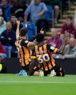 Benjamin Tetteh #30 of Hull City celebrates with goal scorer Ozan Tufan