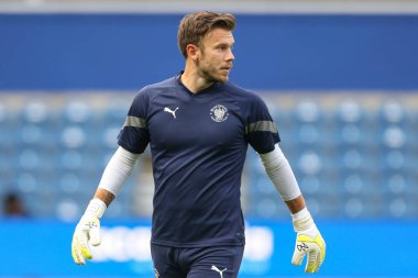 Chris Maxwell #1 of Blackpool during the warm up 