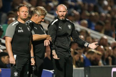 Michael Appleton manager of Blackpool talks to his backroom staff