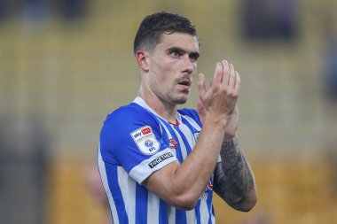 Josh Ruffels #14 of Huddersfield Town applauds the travelling fans after their 2-1 loss