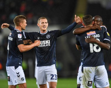 George Saville #23 of Millwall  and team mates celebrates at the end of the game following a late equaliser.