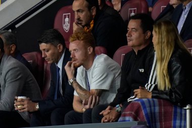 New signing Ryan Woods sits with Tigers owner Acun Ilicali during the match