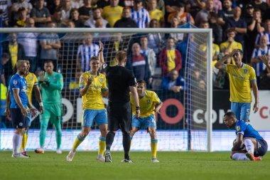 The Sheffield Wednesday players protest to Referee James Oldham during the first half 