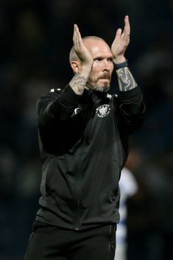 Michael Appleton manager of Blackpool claps at the away fans at the final whistle 