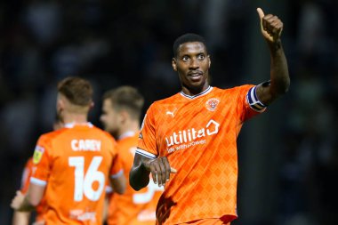Marvin Ekpiteta #21 of Blackpool acknowledges the fans at the final whistle 