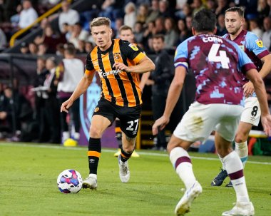 Regan Slater #27 of Hull City runs at Jack Cork #4 of Burnley 