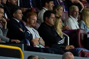 New signing Ryan Woods sits with Tigers owner Acun Ilicali during the match