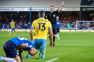 Referee James Oldham shows no interest in Callum Patersons protests in the second half  
