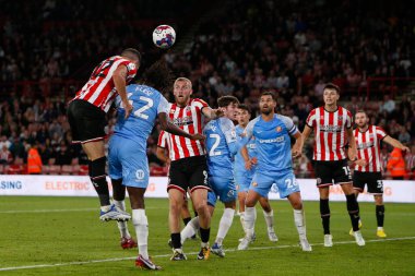 John Egan #12 of Sheffield United attempts a header at goal