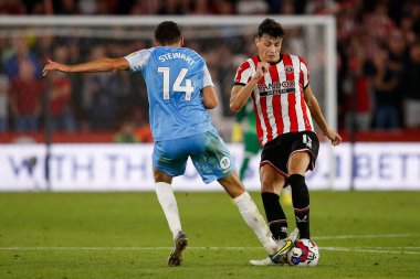 Anel Ahmedhodzic #15 of Sheffield United and Ross Stewart #14 of Sunderland 