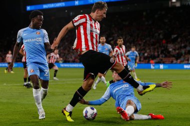 Sander Berge #8 of Sheffield United and Dennis Cirkin #3 of Sunderland 