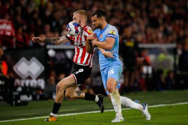Oliver McBurnie #9 of Sheffield United and Bailey Wright #26 of Sunderland 