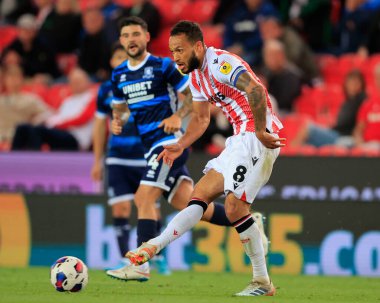 Lewis Baker #8 of Stoke City passes the ball