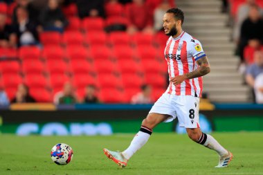 Lewis Baker #8 of Stoke City passes the ball