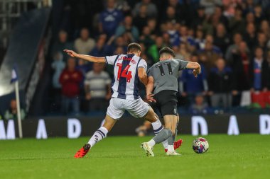 Jayson Molumby #14 of West Bromwich Albion fouls Callum O'Dowda #11 of Cardiff City