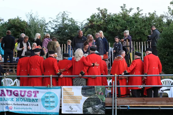 The Chelsea Pensioners pose for a photo with local councillors. 
