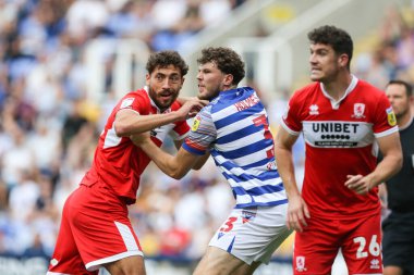 Matt Crooks #25 of Middlesbrough and Tom Holmes #3 of Reading tussle inside the area 