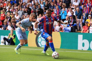 Jordan Ayew of Crystal Palace with Lucas Digne of Aston Villa in close attendance. 