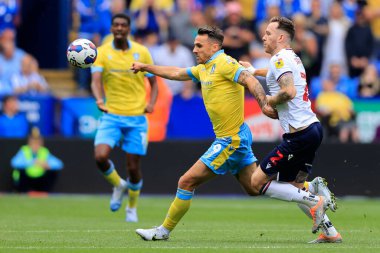 Lee Gregory #9 of Sheffield Wednesday is challenged by Gethin Jones #2 of Bolton Wanderers
