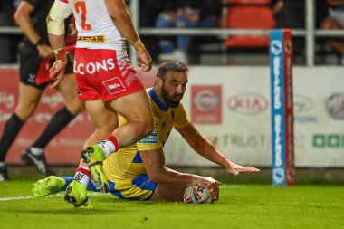 Kane Linnett #12 of Hull KR goes over for a try