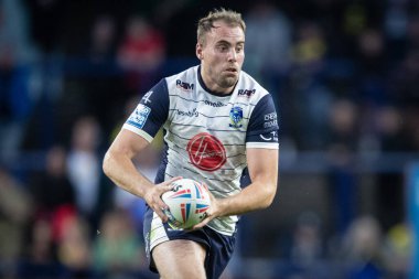 James Harrison #20 of Warrington Wolves runs with the ball 