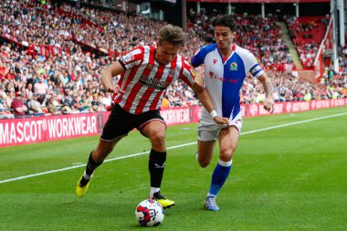 Sander Berge #8 of Sheffield United and Lewis Travis #27 of Blackburn Rovers  