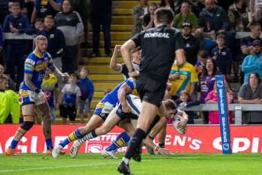 Jake Wardle #34 of Warrington Wolves goes over for a try and makes the score 24-10 during the second half 
