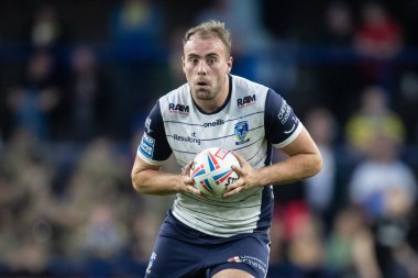 James Harrison #20 of Warrington Wolves runs with the ball 