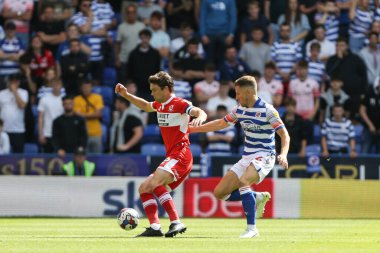 Jonathan Howson #16 of Middlesbrough holds the ball up ender pressure from Sam Hutchinson #4 of Reading 