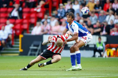 Oliver McBurnie #9 of Sheffield United and Ashley Phillips #33 of Blackburn Rovers  