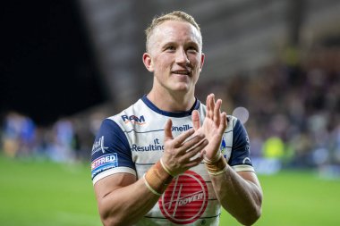 Jason Clark #14 of Warrington Wolves claps his hands and applauds the supporters at full-time 