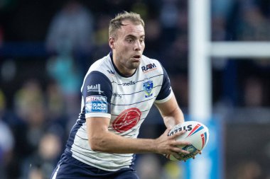 James Harrison #20 of Warrington Wolves runs with the ball 