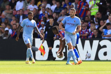 John McGinn of Aston Villa protests his innocence to referee Andy Madley