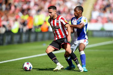 George Baldock #2 of Sheffield United and Tayo Edun #7 of Blackburn Rovers  