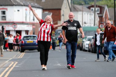 Fans of Sheffield United arrive at Bramall Lane for todays game