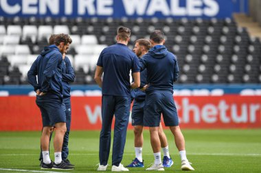Luton Town Players inspect the pitch pre kick off