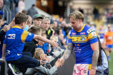 Blake Austin #6 of Leeds Rhinos meets with the supporters after the game 